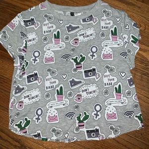 TEE SHIRT WITH CUTE LITTLE DESIGNS/PICTURES